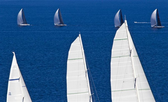 Mini Maxi Fleet dwarfed by the sails of superyacht Hetairos - Photo by Rolex Carlo Borlenghi