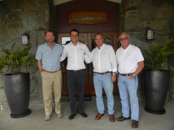 Riza Cakir of the Emek Marin company (2nd from left) with PAE’s president Dan Streech (far left), Chief of Design Jeff Leishman, and Vice President Jim Leishman at PAE’s world headquarters in Dana Point, CA.