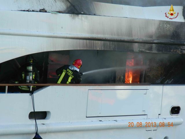 Firefighters extinguishing the fire on board 56m Benetti Motor Yacht FB261