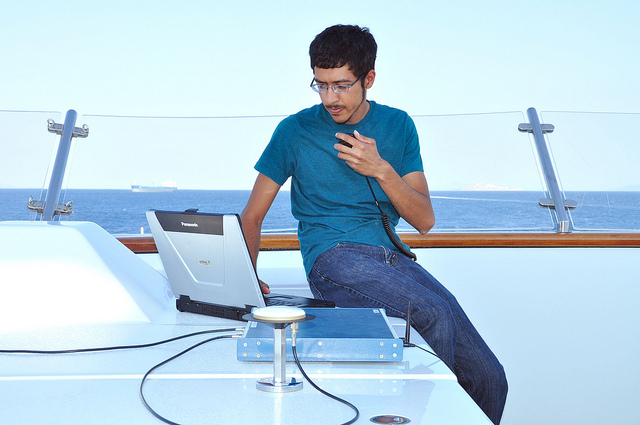 Graduate student Jahshan Bhatti with the laptop equipment used to spoof the superyacht's GPS