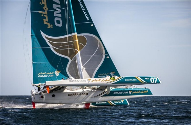 Oman Air Musadam flies two hulls on approach to the Fastnet Rock - Photo by Rolex Daniel Forster