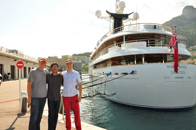 The University of Texas team, from left to right, Ken Pesyna, Jahshan Bhatti, and Professor Todd Humphreys, pose behind the White Rose docked in Port de Cap d'Ail