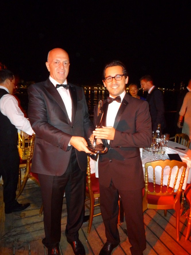 Vicem's Hafizoglu and Ozbakir with the 2013 World Yacht Trophy for the 46m Vulcan superyacht