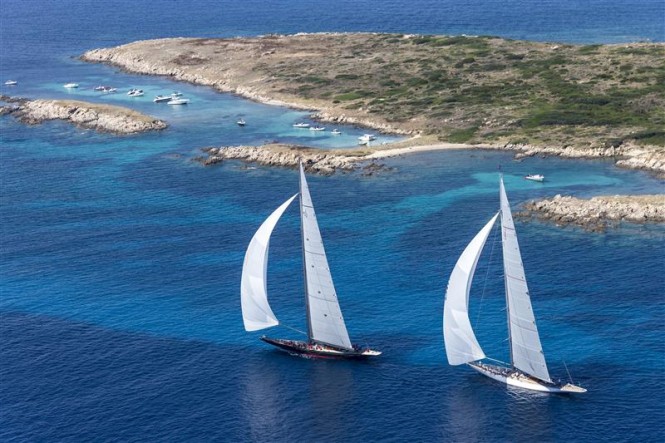 Superyacht Rainbow and charter yacht Ranger sail pass Isola delle Bisce