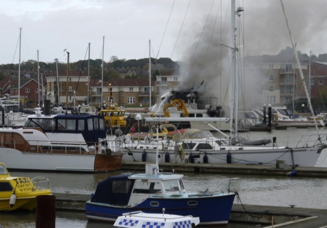 The burning Kahu Yacht at East Cowes. Credit George Chastney. Photo courtesy of Cowes Harbour Commission