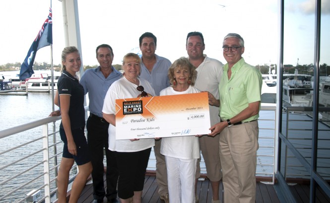 Expo representatives present the cheque to Paradise Kids