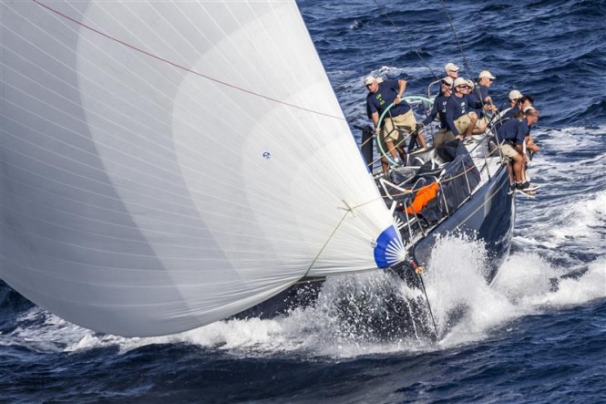 Hap Fauth at the helm of Bella Mente - Credit: Rolex/Carlo Borlenghi 