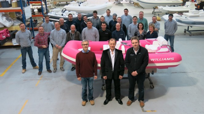 Mathew Hornsby John Chartres and James Barke with the Breast Cancer Care yacht tender and Williams factory staff
