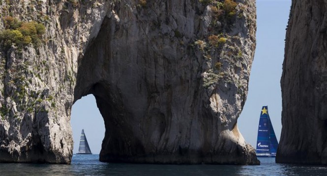 Esimit Europa 2 yacht was first to pass the famous Faraglioni Islands. Photo by Rolex Carlo Borlenghi
