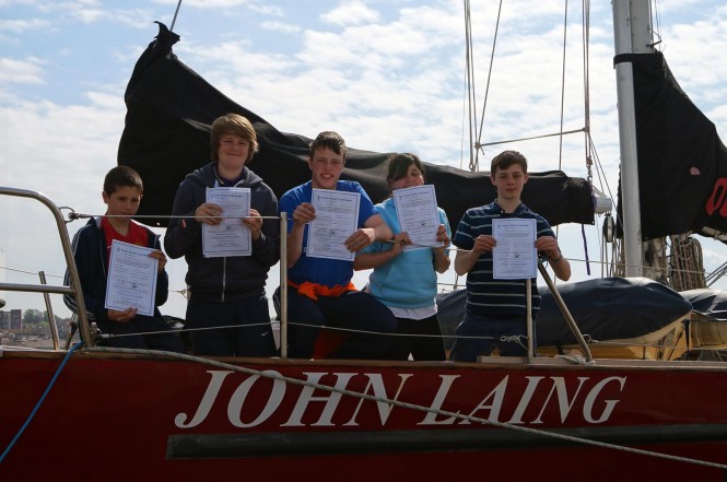 L-R John Bratherton Callum Archibald Robert Jelley Jodie Beckham Osc aboard John Laing yacht