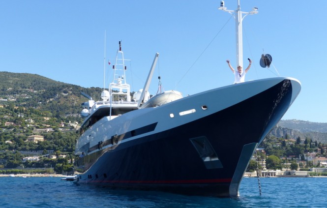 Captain looking very happy at the bow of the Double Trouble yacht with a full hull wrap by Wild Group International - Image credit to Wild Group International (2)-001 Captain looking very happy at the bow of the Double Trouble yacht with a full hull wrap by Wild Group International - Image credit to Wild Group International (2)-001