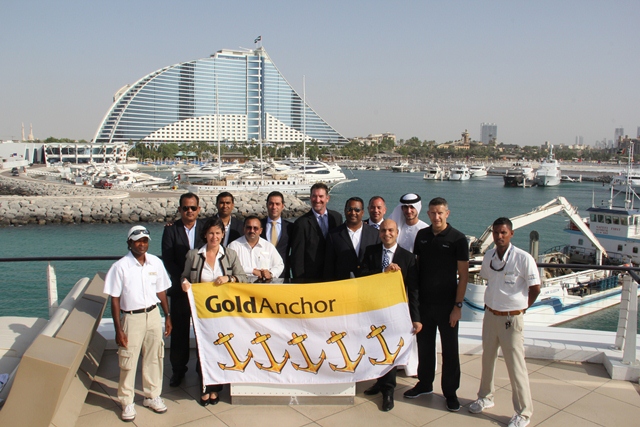 John Hogan Superior centre presenting Jumeirah Beach Hotel Marina management  staff with their 5 Gold Anchor accreditation