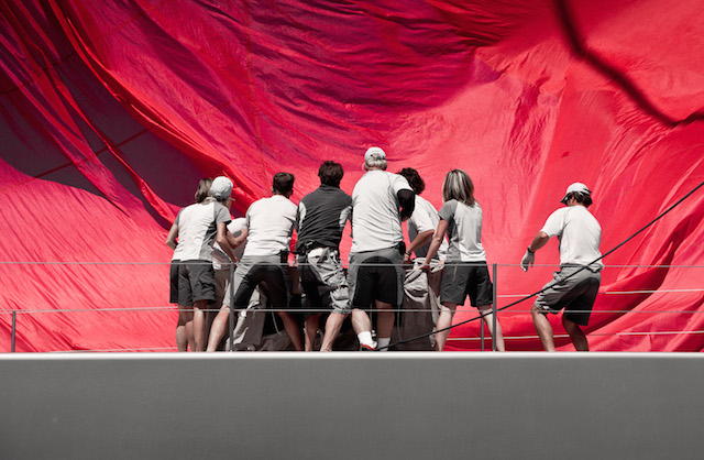 The crew of Ghost tirelessly pack their kite at the end of the final run Jeff Brown | Superyacht Media
