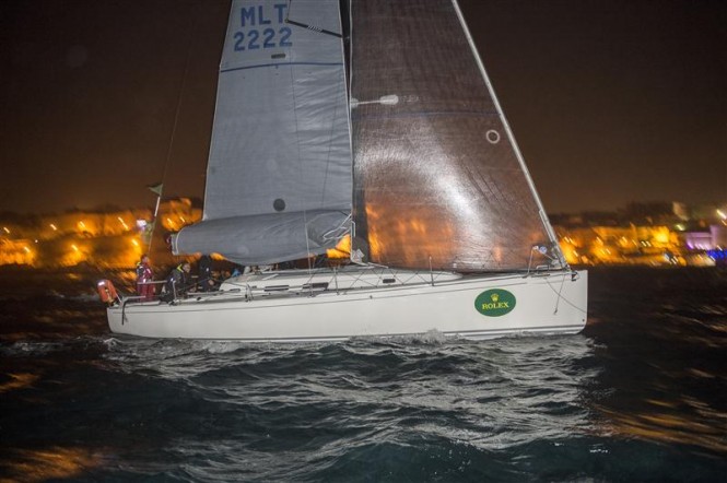 ARTIE (MLT) crossing the finish line in Marsamxett Harbour to become winner of the Rolex Middle Sea Race 2014 - Photo by Rolex Kurt Arrigo