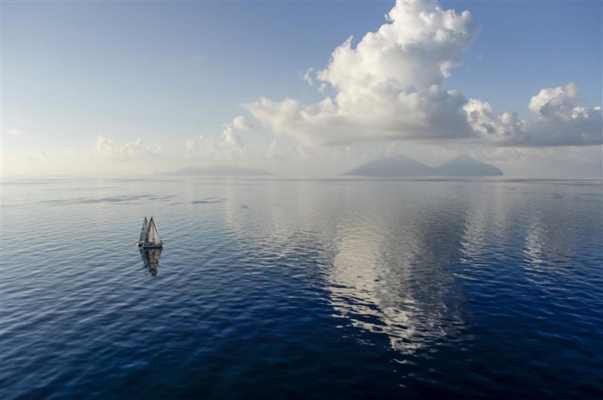 Light conditions as the fleet progresses slowly to the north of Sicily - Photo by Rolex Kurt Arrigo
