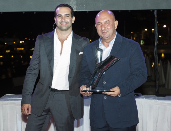 Notis Menelaou (left) Sales Manager at Gulf Craft receiving the Award Notis Menelaou (left) Sales Manager at Gulf Craft receiving the Award