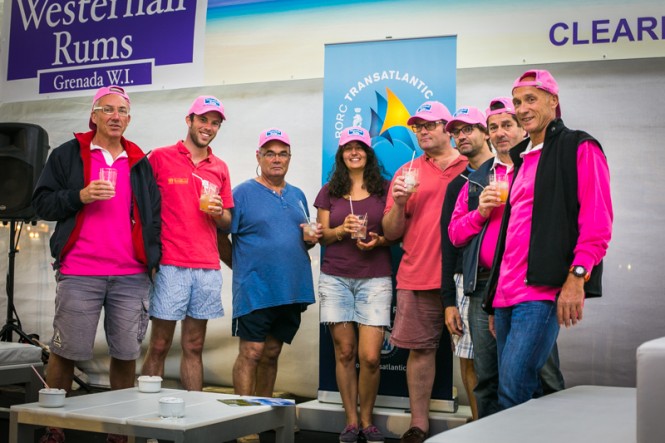 Competitors enjoy the Westerhall Rums punch and their new pink caps! © RORC James Mitchell