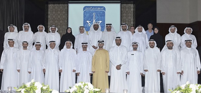 His Highness Sheikh Mansoor bin Mohammed bin Rashid Al Maktoum standing in the middle of DMCA’s partners who were honored by "Dubai Maritime City Authority" at the closing ceremony of “Dubai Maritime Week 2014”