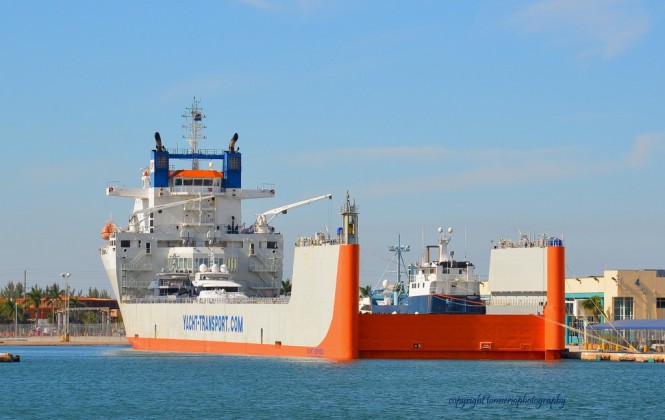 DYT Yacht Transport’s 686’ flagship Yacht Express is shown here in Port Everglades, Fla., before heading Down Under with its cargo of precious yachts, including the 126-foot research vessel M/V OCEARCH (blue hull). (photo credit Tom Serio Photography).  