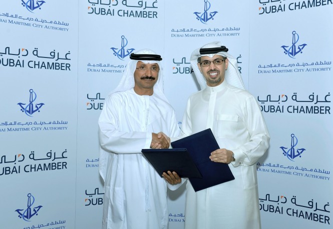 (Right to Left):  H.E. Hamad Buamim, President and CEO,  Dubai Chamber and H.E. Sultan Bin Sulayem, Chairman of Dubai Ports, Customs and Free Zone Corporation and President of DMCA, during the MoU signing ceremony. 