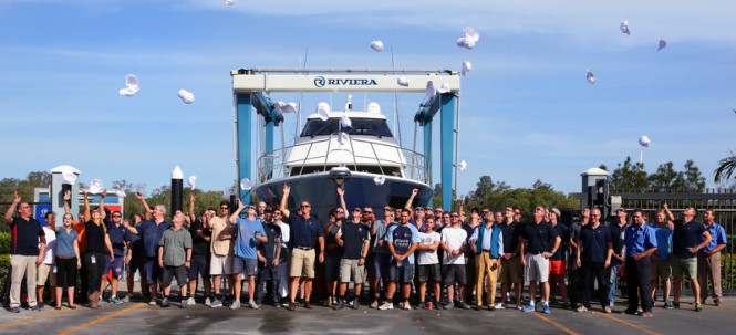 Rodney Longhurst and Riviera's team of master craftsman celebrate the launching of the new motor yacht 77 Enclosed Flybridge