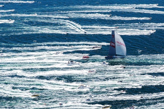 Wild Oats XI surges up the Derwent River towards Hobart amid a sea of white on her way to a historic eighth line honours victory in the Rolex Sydney Hobart Yacht Race. (Credit: Andrea Francolini/AUDI)