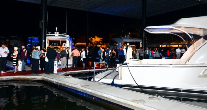 Guests enjoy cocktails in an exclusive setting amid all the latest relesases from Riviera and Belize Motoryachts