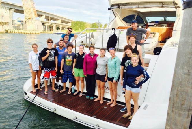 Group shot of the outreach program onboard the 72ft Mangusta Yacht DEFIANCE