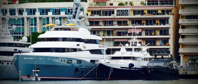 Three Luxury Superyachts wrapped by Wild Group moored in Monaco