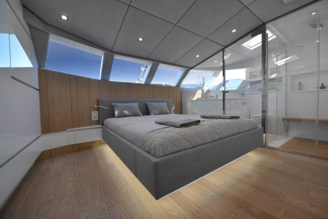 BLUE BELLY Yacht - Master Suite with an amazing glass panel separating his and hers bathrooms from sleeping area