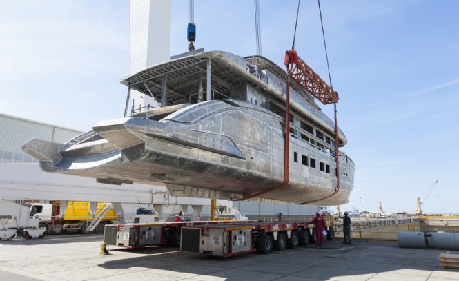 Hull and superstructure of superyacht DYNAMIQ D4 being moved to the new shed