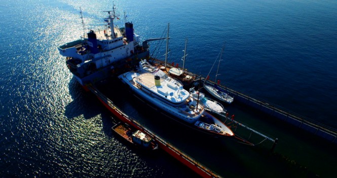 Classic 160 motor yacht CLARITY being loaded onto a cargo ship