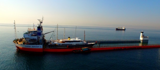 Classic superyacht CLARITY on a cargo ship