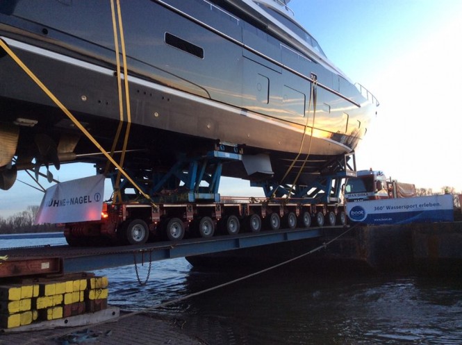 Princess 30M KOHUBA makes her way from the barge onto the road to the exhibition centre - Image by Princess Yachts International plc