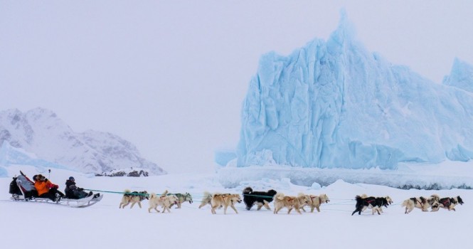 Dog sledding is still used as transport across Greenland toady.