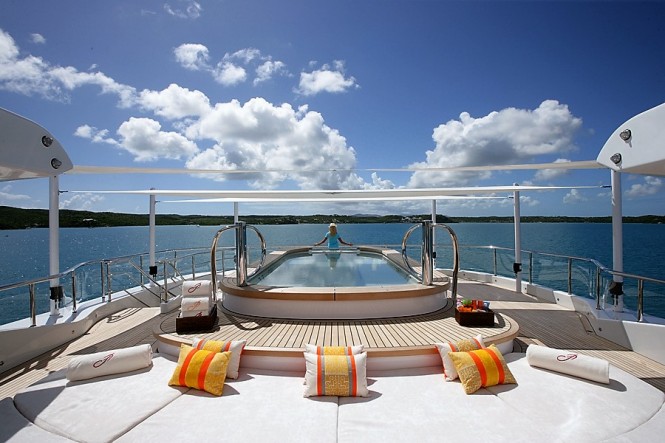 Motor yacht AMARYLLIS - a sizeable Jacuzzi pool and sun pads on the sun deck.