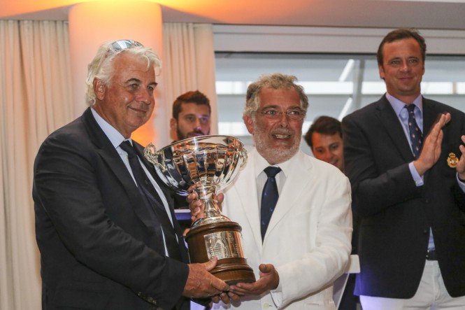 Franco Manzoli and Leonardo Servi (Scricca) have been awarded by Agostino Randazzo, President of the Circolo della Vela Sicilia.  Photo Credit: Cécilia Conterno