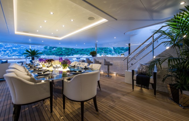 Luxury yacht 11.11 - Aft upper deck alfresco dining and wet bar. Photo credit Jeff Brown