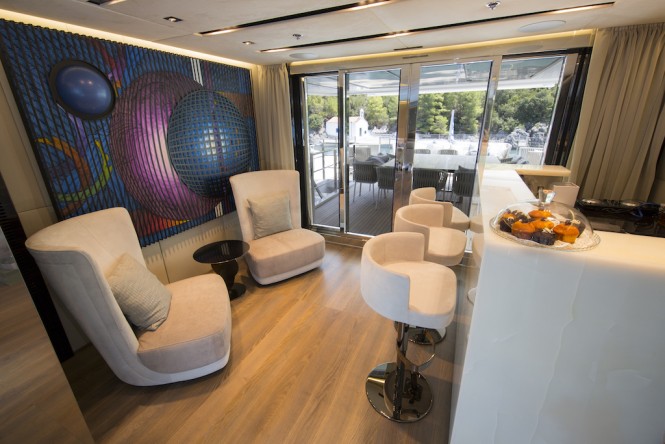 The skylounge wet bar and upper aft deck dining