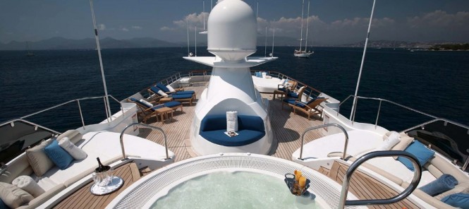 The sun deck spa pool and sunloungers on SHAKE N' BAKE TBD