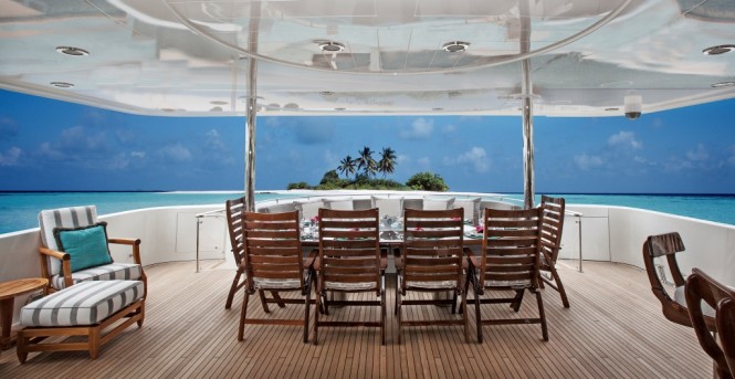 Aft deck alfresco dining aboard superyacht KEMOSABE