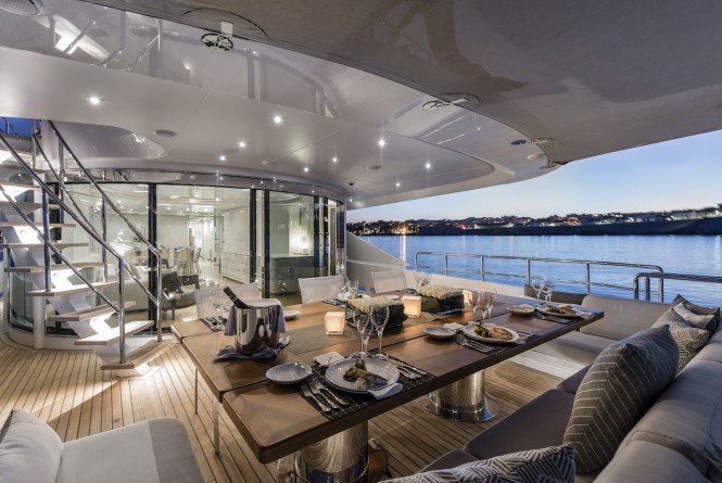 Alfresco dining on the main deck aft of superyacht DESTINY