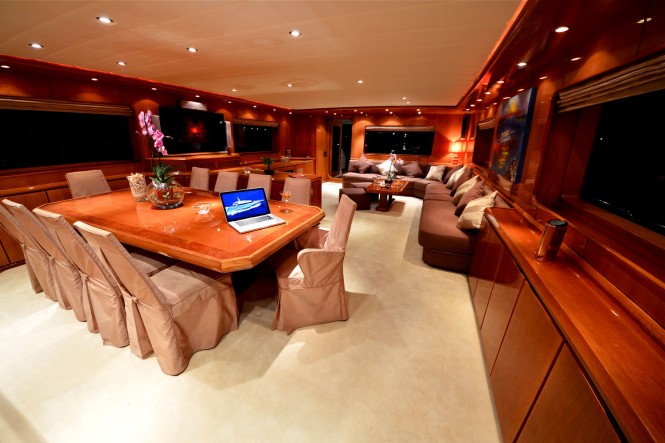 Formal dining area and maon salon aboard superyacht EVIDENCE