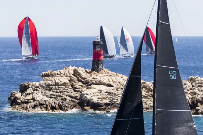 The rocky coast of Sardinia creates an impressive setting for the Loro Piana Superyacht Regatta. Photo credit: YCCS