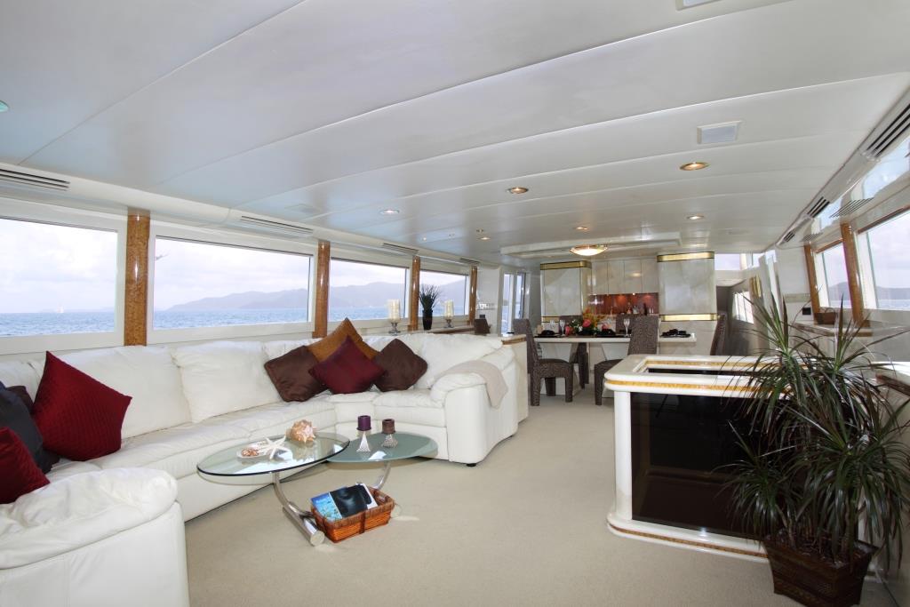 Salon and formal dining area aboard superyacht INSATIABLE