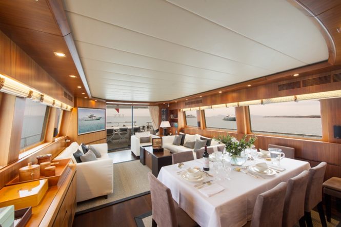 Formal dining area and salon interior aboard M/Y LEX