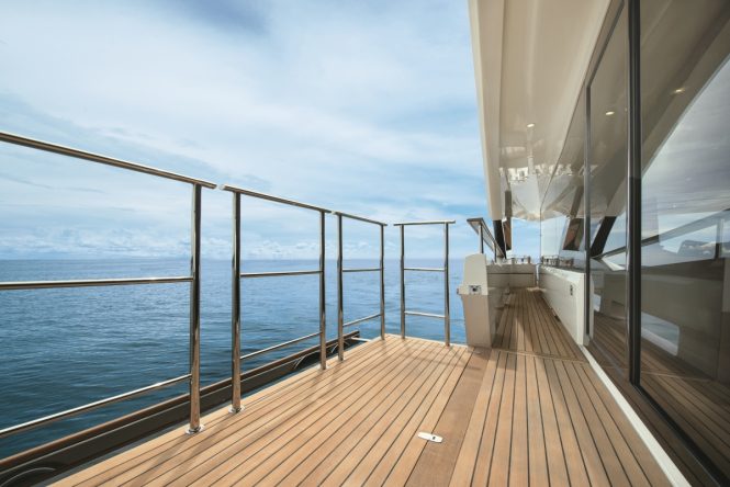 Luxury yacht MCY 96 - Fold down balcony on the main deck. Photo credit Monte Carlo Yachts