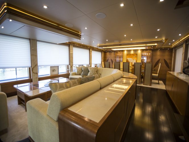 Main salon and formal dining area aboard luxury yacht SERENITY