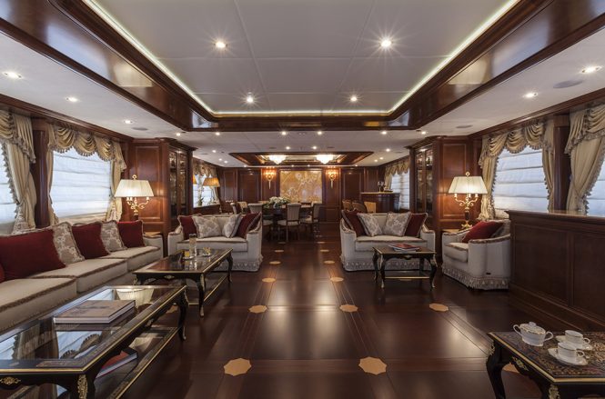 Main salon and formal dining area with bar aboard superyacht PRIDE