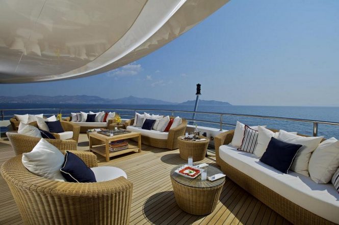 Seating along the upper deck stern of luxury yacht O'MEGA